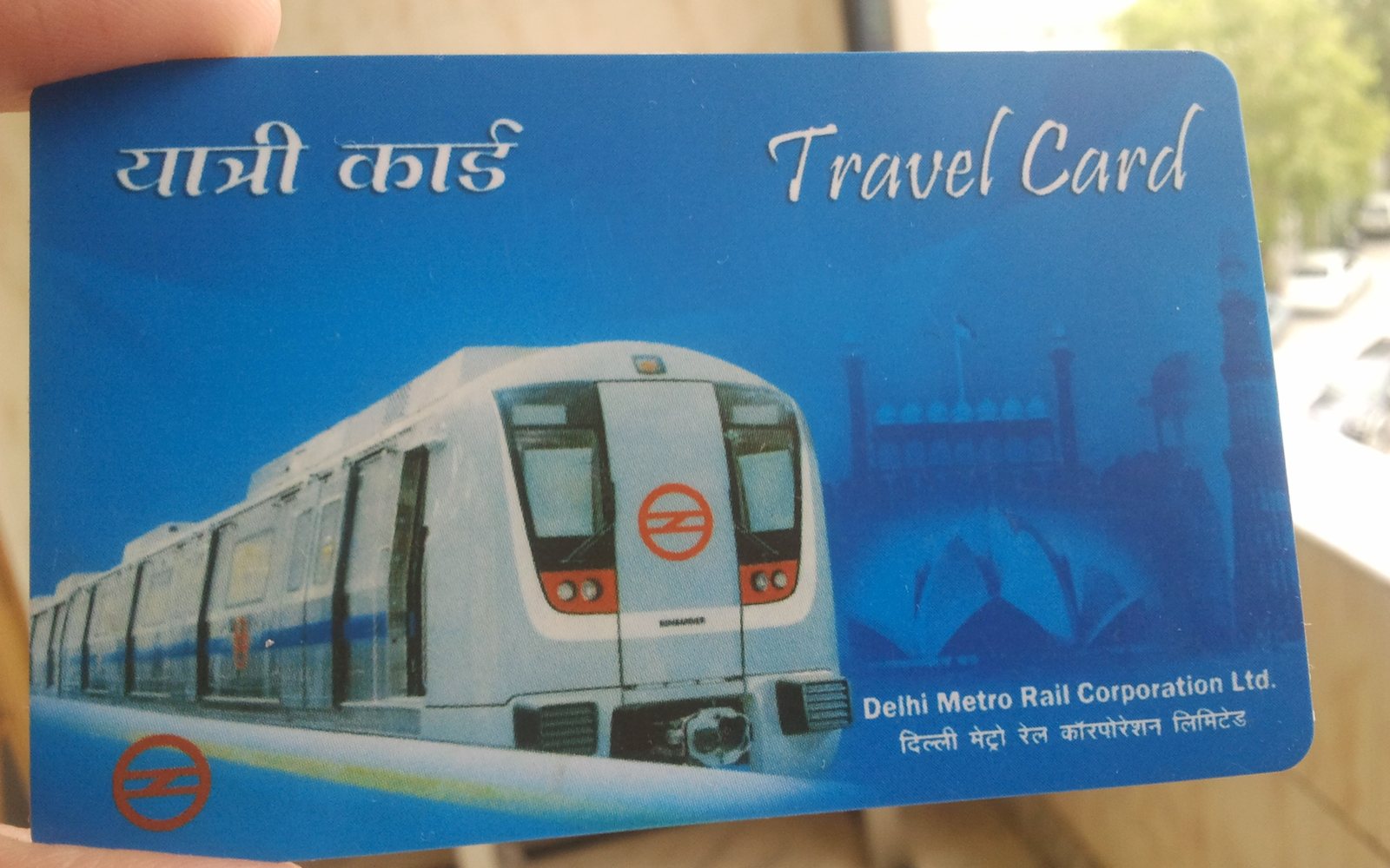 Delhi Metro smart card (DMRC Travel Card) held in a hand